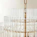 Lustre moderne en verre transparent avec finition dorée