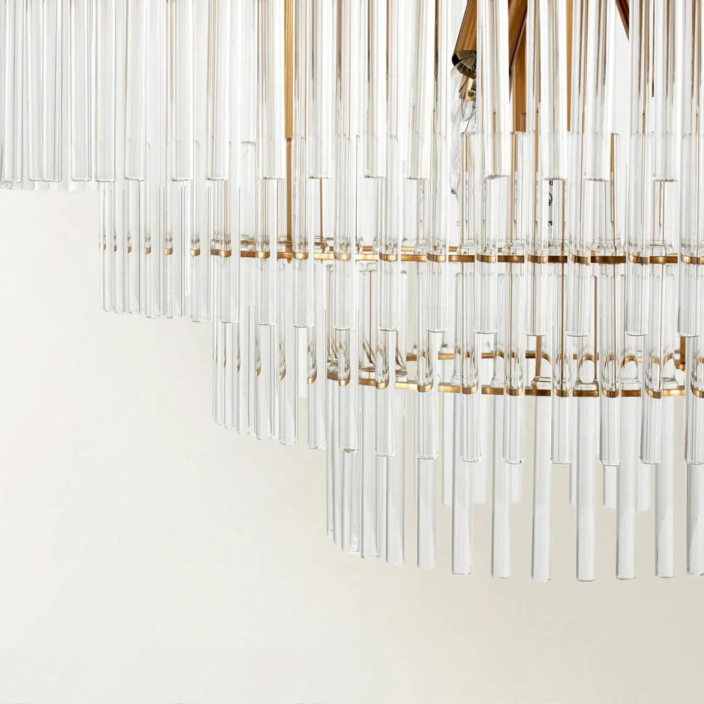 Lustre moderne en verre transparent avec finition dorée
