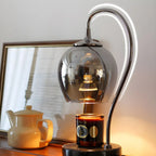 Lampe de table moderne en métal noir et verre avec socle porte-gobelet