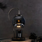 Lampe de table moderne en métal noir et verre avec socle porte-gobelet