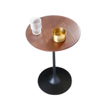 Table d'appoint ronde minimaliste en bois brun avec piètement en métal