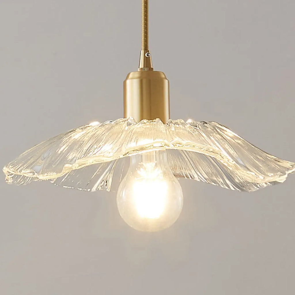 Suspension moderne en verre transparent avec abat-jour marguerite et accessoires dorés
