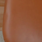 Fauteuil à bascule rembourré en similicuir avec repose-pieds en option