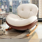 Fauteuil à bascule ergonomique arrondi et rembourré pour salon