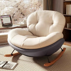 Fauteuil à bascule ergonomique arrondi et rembourré pour salon