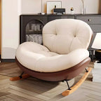 Fauteuil à bascule ergonomique arrondi et rembourré pour salon