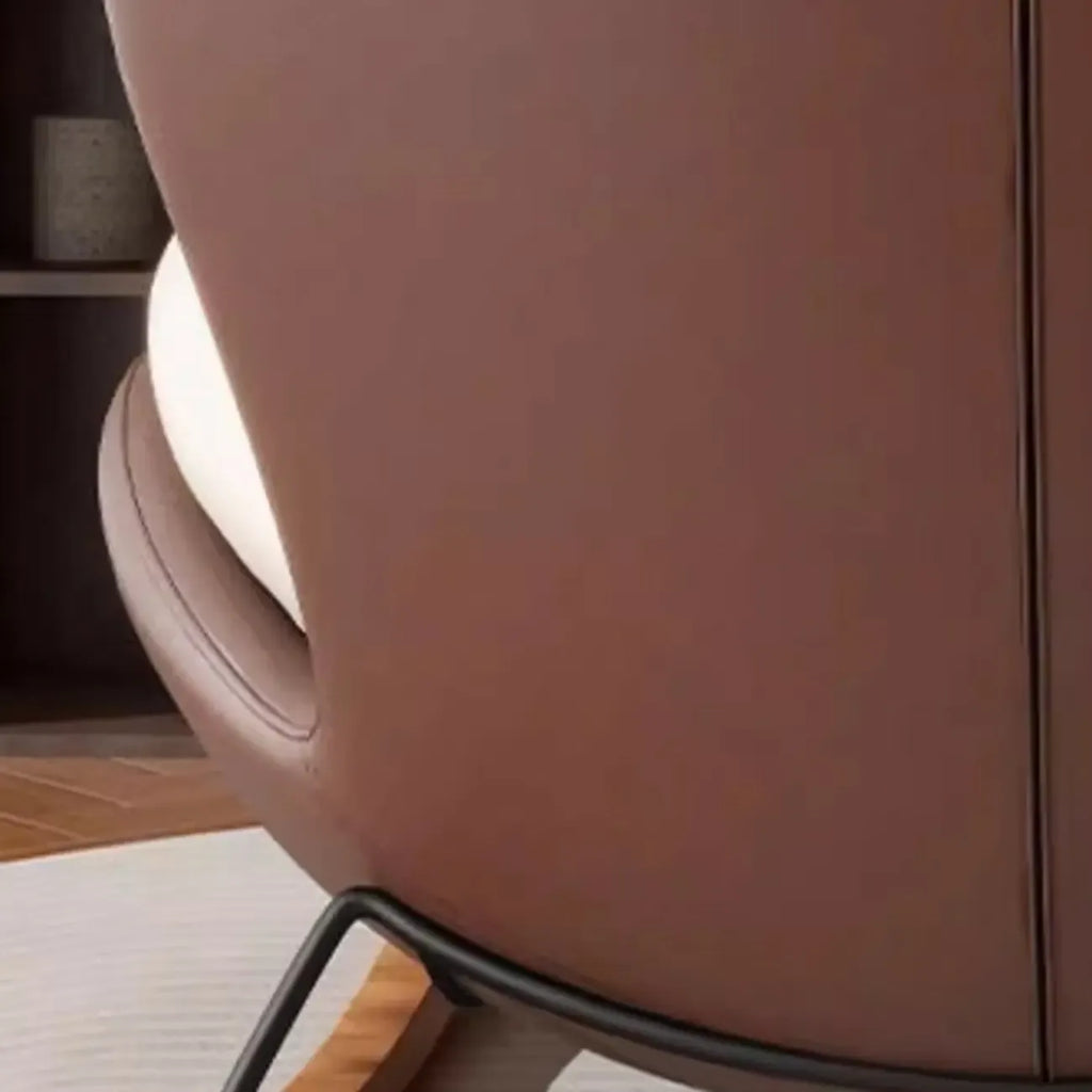 Fauteuil à bascule ergonomique arrondi et rembourré pour salon