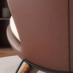 Fauteuil à bascule ergonomique arrondi et rembourré pour salon