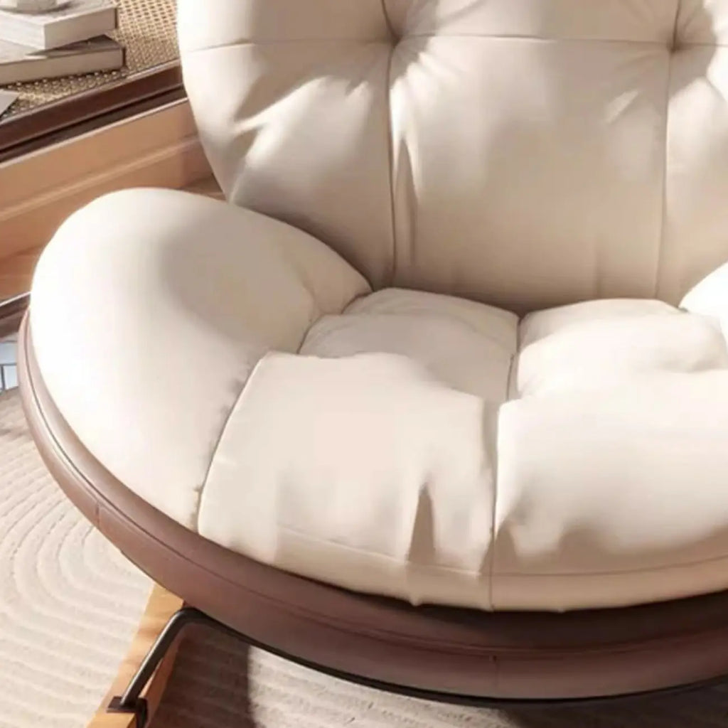 Fauteuil à bascule ergonomique arrondi et rembourré pour salon