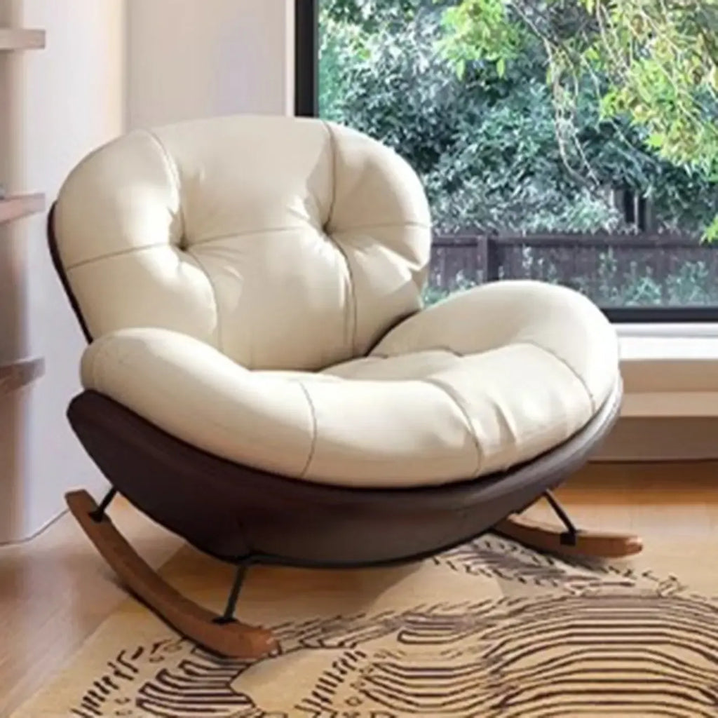 Fauteuil à bascule ergonomique arrondi et rembourré pour salon