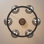 Lustre industriel en métal noir avec abat-jour en verre gris