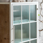 Meuble d'appoint bohème blanc avec porte et tiroirs en verre