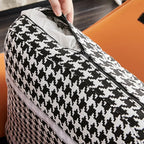 Fauteuil à bascule rembourré à motif pied-de-poule avec accoudoirs droits