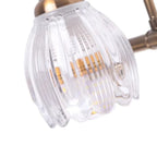 Applique murale moderne à trois lampes en laiton avec globe, à placer au-dessus du miroir.