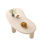 Petite table basse blanche moderne de forme irrégulière, facile à assembler