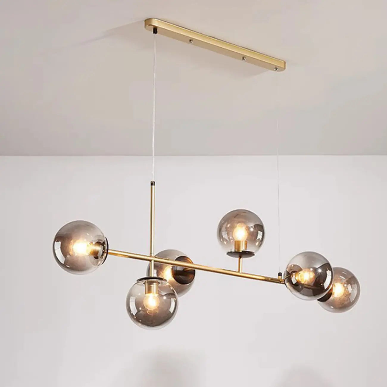 Lampadario a sospensione da isola a 6 luci con globi in vetro e lunghezza regolabile