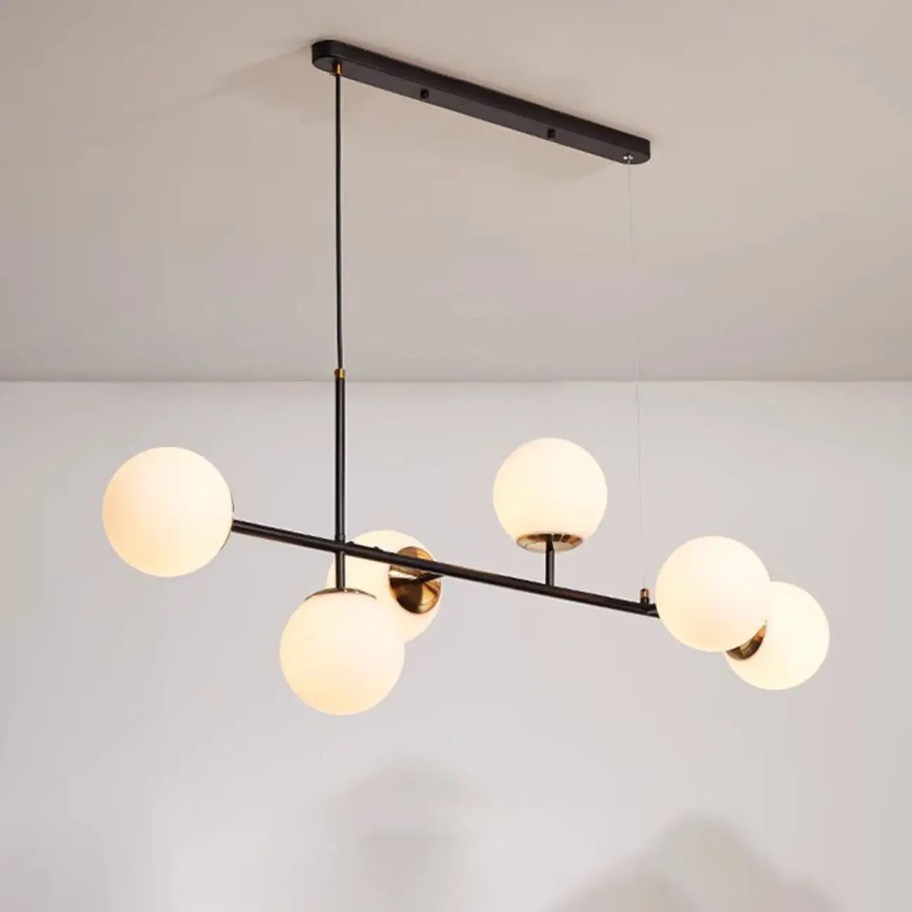 Lampadario a sospensione da isola a 6 luci con globi in vetro e lunghezza regolabile