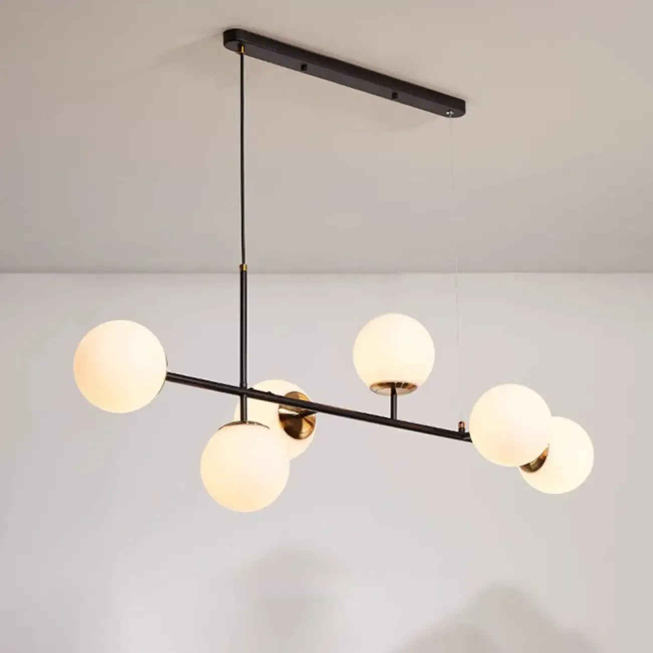 Lampadario a sospensione da isola a 6 luci con globi in vetro e lunghezza regolabile