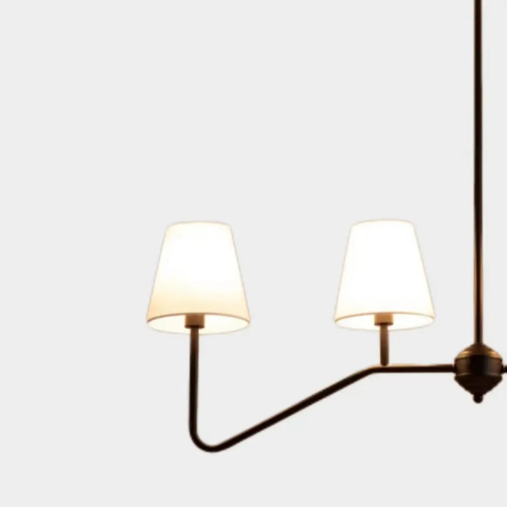 Suspension îlot en métal noir avec 4 lumières et habillage cylindrique en tissu
