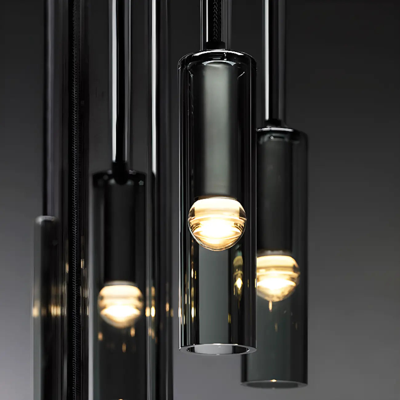 Suspension cylindrique en verre gris pour îlot de cuisine