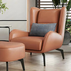 Fauteuil d'appoint moderne en cuir beige avec un coussin