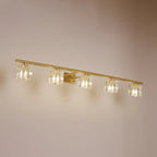 Applique murale moderne dorée pour salle de bain avec abat-jour en cristal transparent