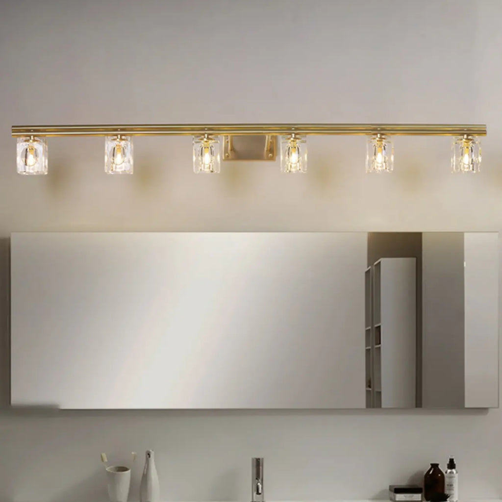 Applique murale moderne dorée pour salle de bain avec abat-jour en cristal transparent