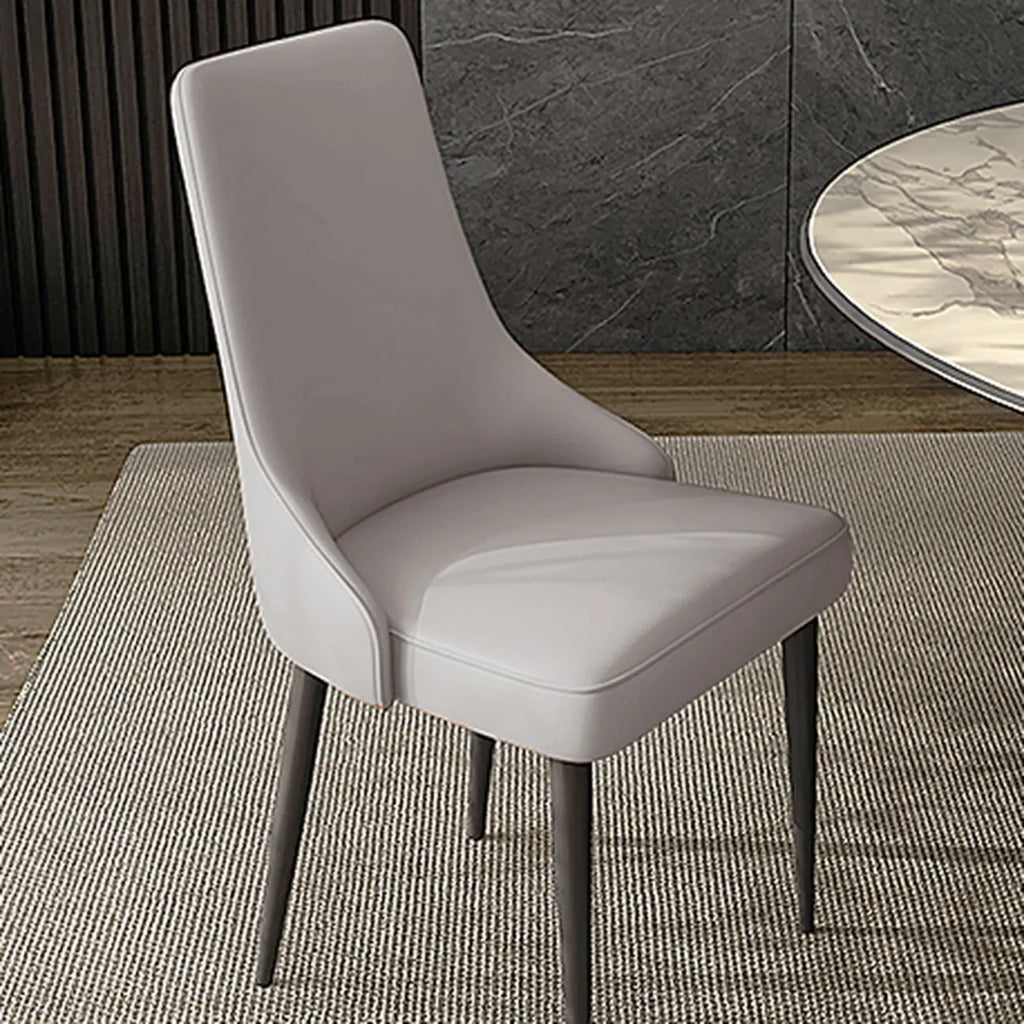 Chaise de salle à manger moderne sans accoudoirs, revêtue de similicuir et à dossier haut