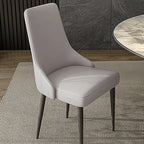 Chaise de salle à manger moderne sans accoudoirs, revêtue de similicuir et à dossier haut