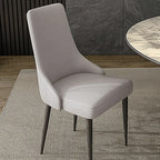 Chaise de salle à manger moderne sans accoudoirs, revêtue de similicuir et à dossier haut