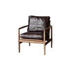 Fauteuil en cuir avec accoudoirs en bois pour salon