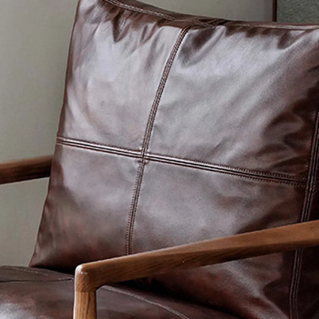 Fauteuil en cuir avec accoudoirs en bois pour salon