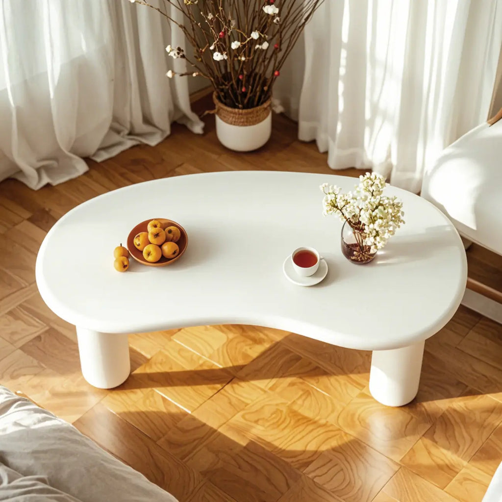 Petite table basse blanche moderne de forme irrégulière, facile à assembler