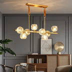 Grande suspension linéaire en métal et cristal doré pour cuisine