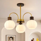 Lustre en verre blanc avec arche dorée, accents de bois et sphère en verre blanc