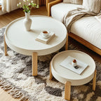 Table basse ronde minimaliste en bois beige avec plateau
