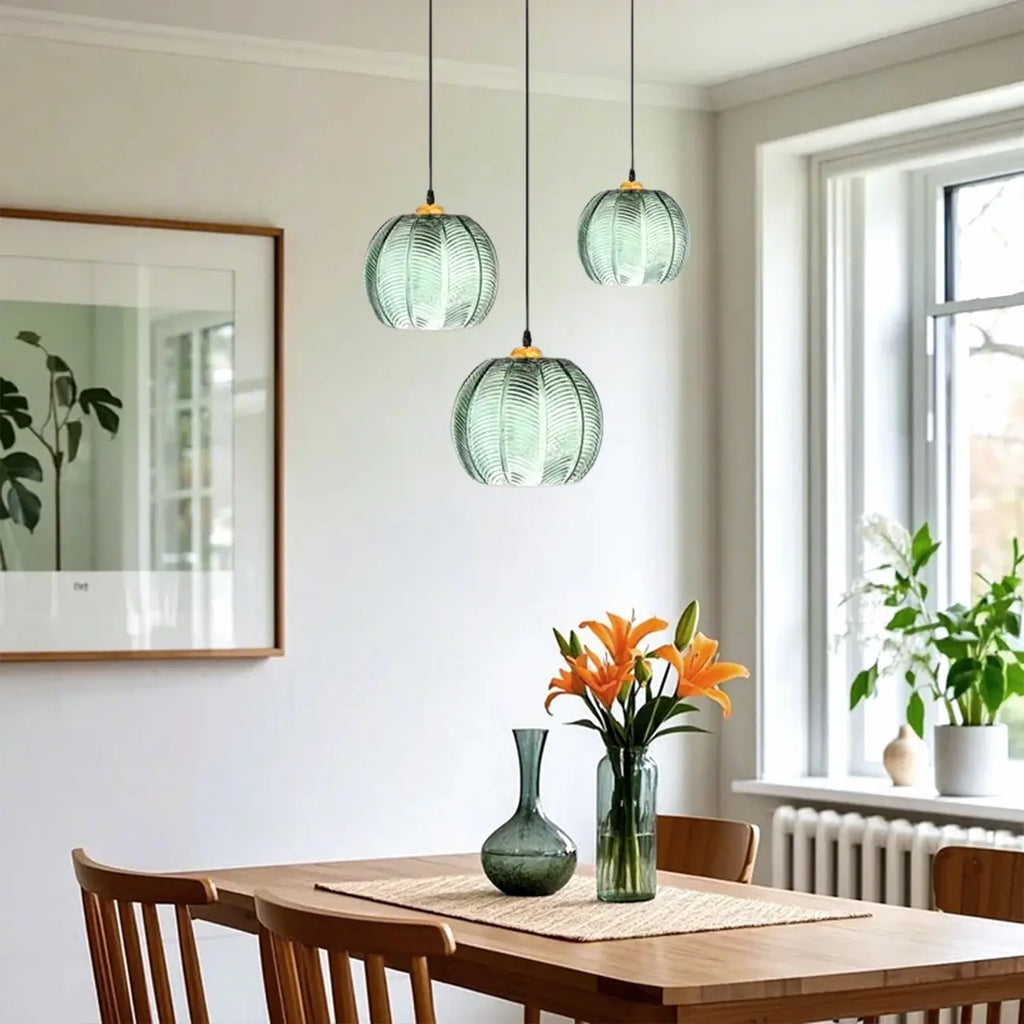 Suspension globe moderne en verre vert inspirée des feuilles