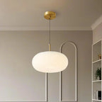 Suspension LED en forme de galet en acrylique crème pour salon