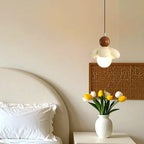 Suspension LED rose poudré avec motif floral en argile pour chevet