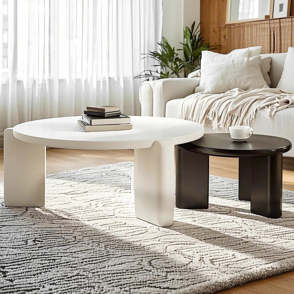 Table basse ronde en bois à trois pieds, noire et blanche