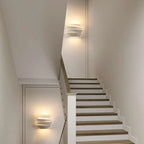 Applique murale minimaliste blanche à plusieurs niveaux pour l'éclairage de la chambre