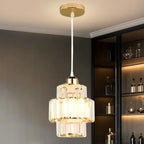 Elegante lampada a sospensione cilindrica in cristallo trasparente per sala da pranzo