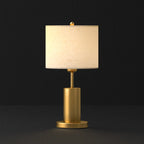 Lampe de table en forme de tonneau, en métal doré et tissu, à brancher