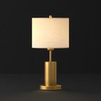 Lampe de table en forme de tonneau, en métal doré et tissu, à brancher