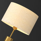 Lampe de table en forme de tonneau, en métal doré et tissu, à brancher
