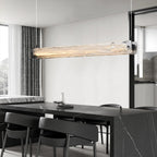 Suspension élégante en verre pour îlot de cuisine, avec éclairage LED à intensité variable.