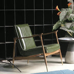 Fauteuil moderne en cuir vert avec dossier haut
