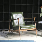 Fauteuil moderne en cuir vert avec dossier haut