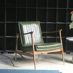 Fauteuil moderne en cuir vert avec dossier haut