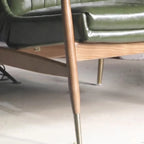 Fauteuil moderne en cuir vert avec dossier haut